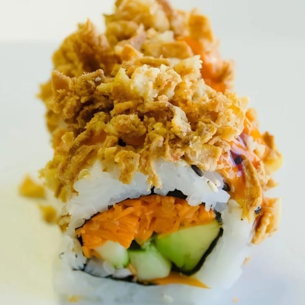 My Sushi & Catering LLC's sushi roll with crispy topping, orange carrots, and green avocado.