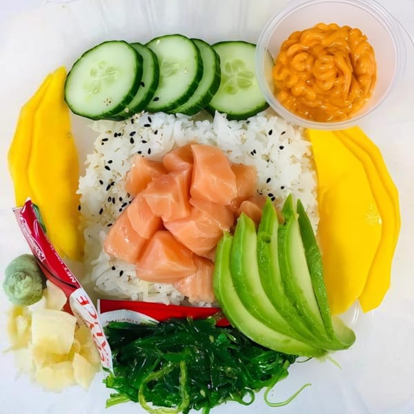 My Sushi & Catering LLC poke bowl with salmon, rice, mango, cucumber, avocado, and seaweed salad.